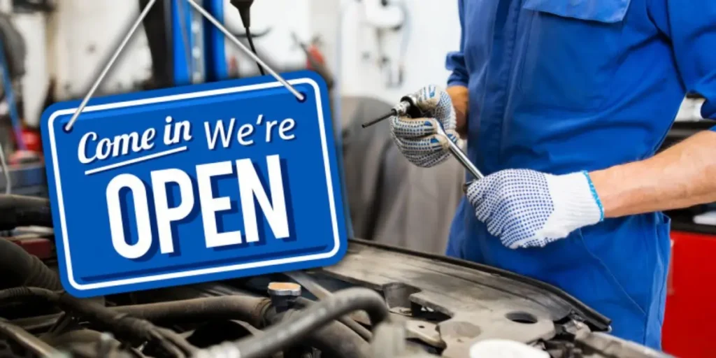Mechanic repairing car engine at auto garage for professional Car Servicing in London – featured by The London Magazine